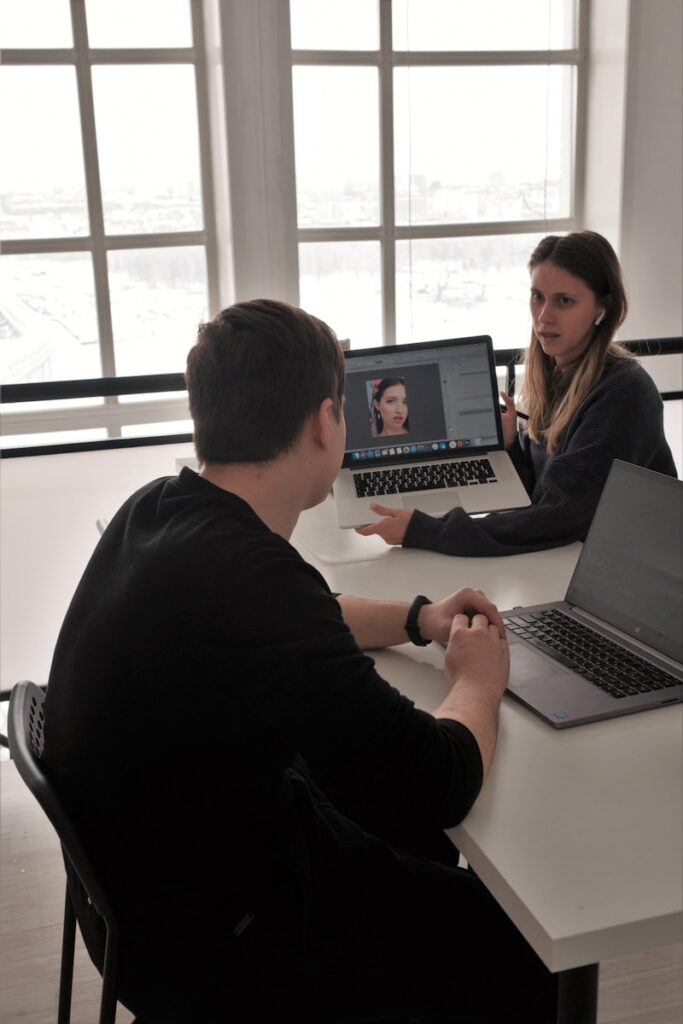 Photo by Aleksandra Sapozhnikova man in black long sleeve shirt using macbook pro